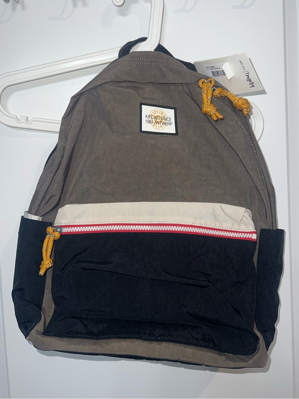 Kipling Green and Black Canvas Backpack with white Accents
Yellow zipper pulls